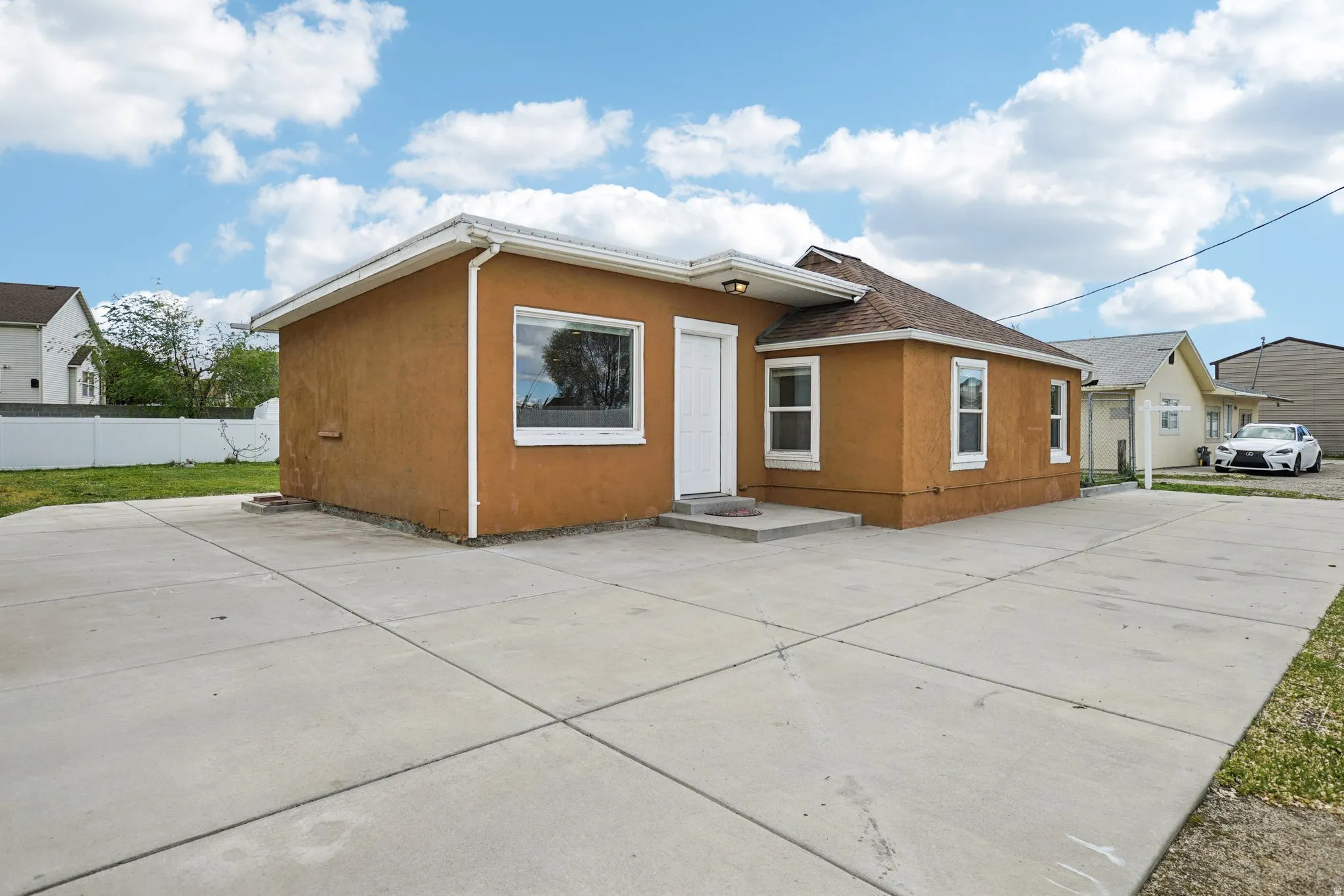 Back of house featuring stucco siding