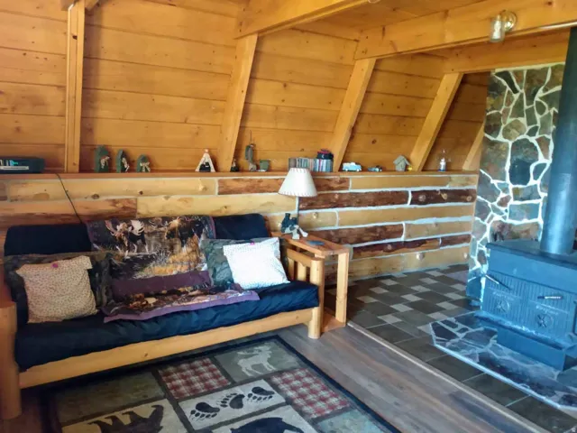 Relaxing sauna / steam room featuring wooden walls and wood finished floors