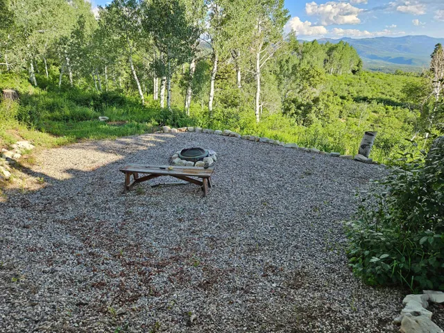 View of yard with a fire pit