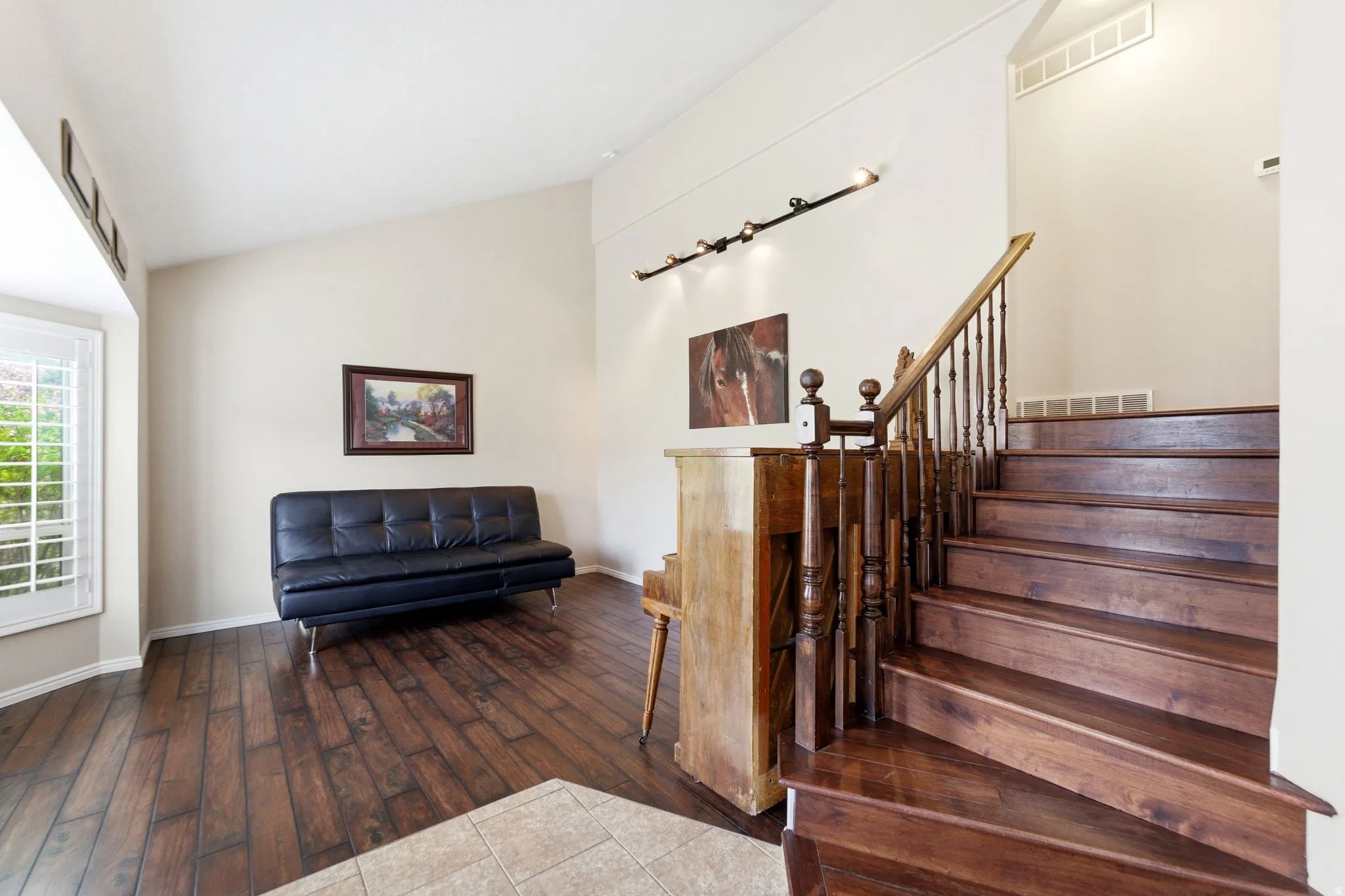 Stairs featuring hardwood / wood-style flooring and baseboards