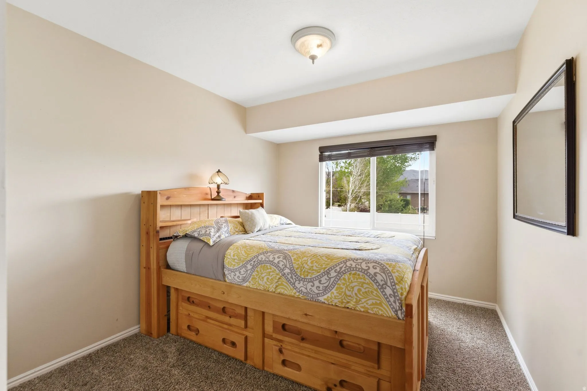 Carpeted bedroom with baseboards