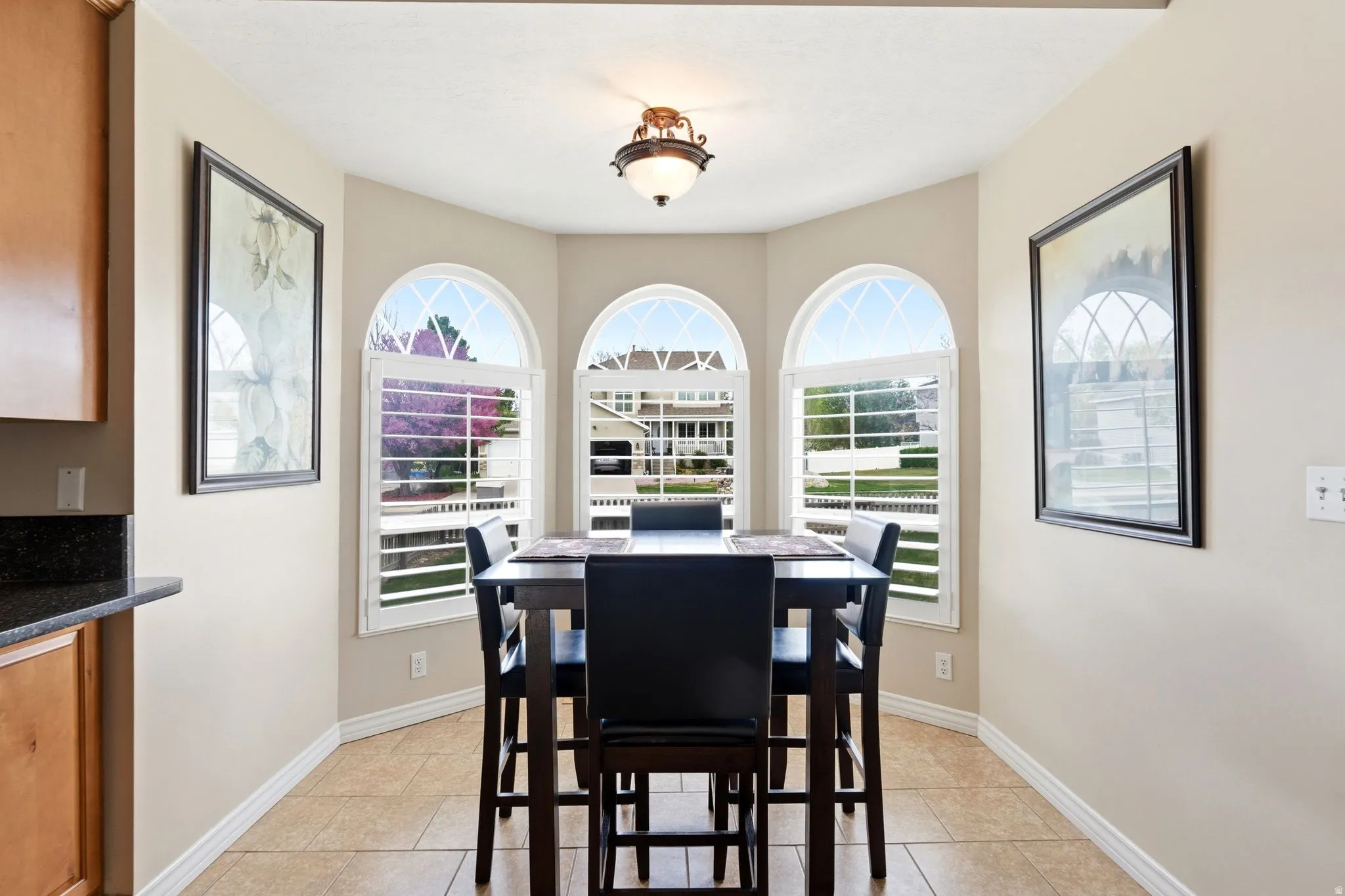 Dining area with light tile patterned floors