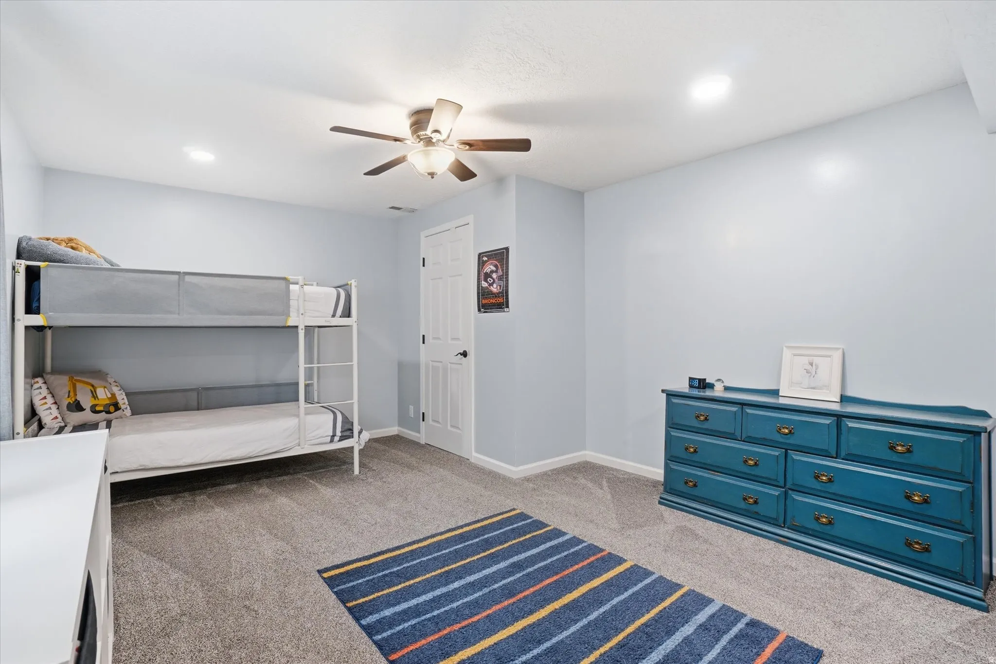 Bedroom featuring dark carpet, a ceiling fan, and recessed lighting