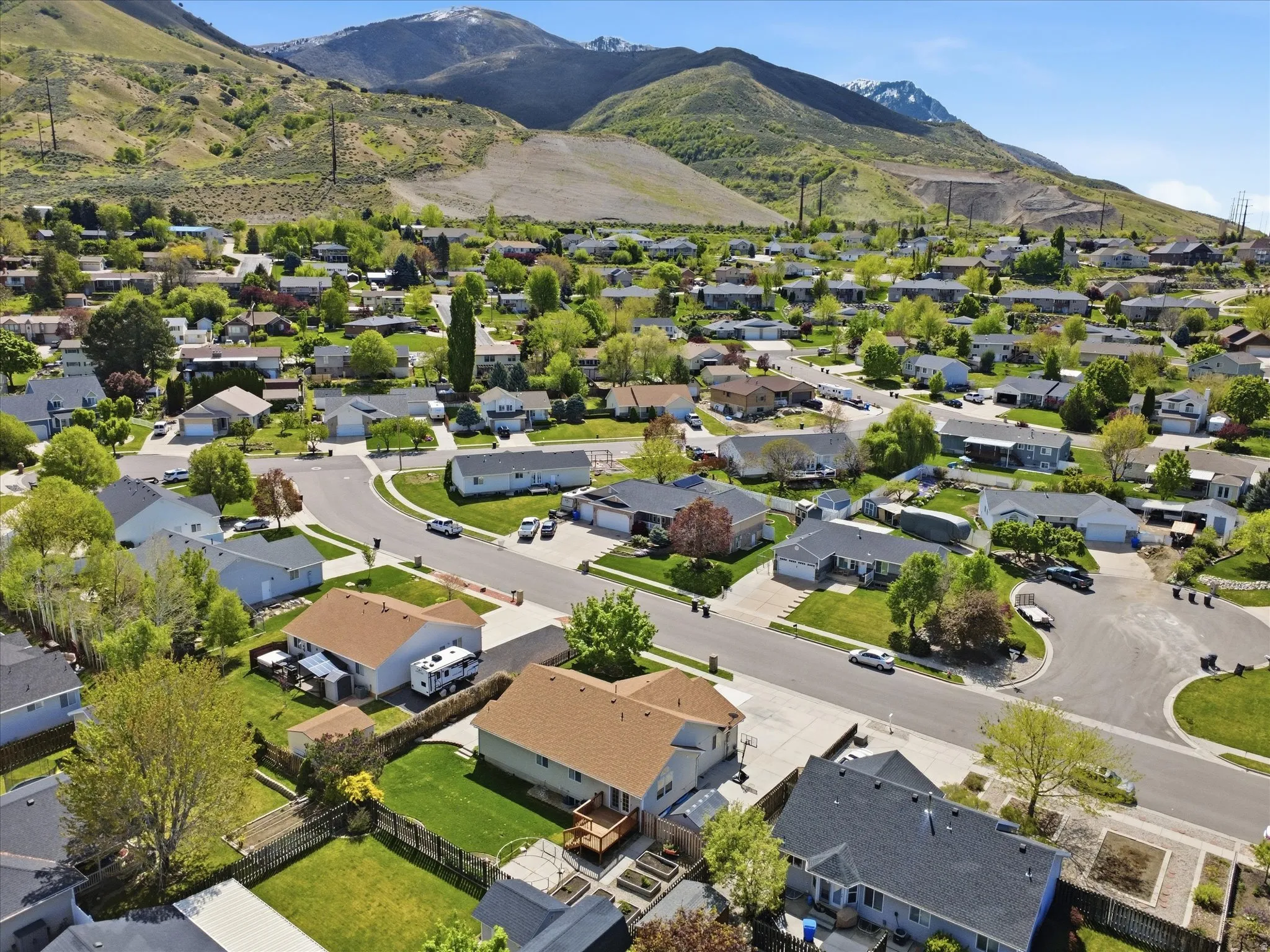 Aerial view of residential area featuring a mountainous background