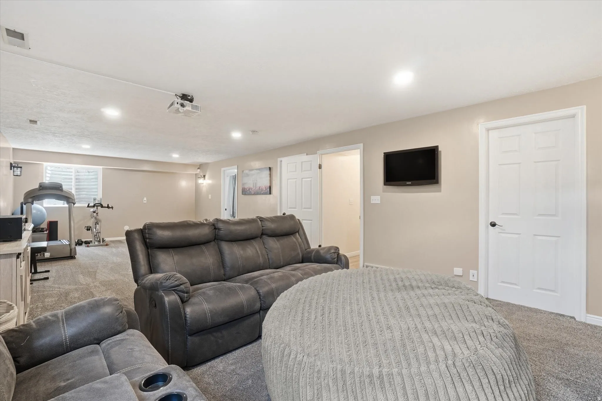 Cinema featuring carpet floors and recessed lighting