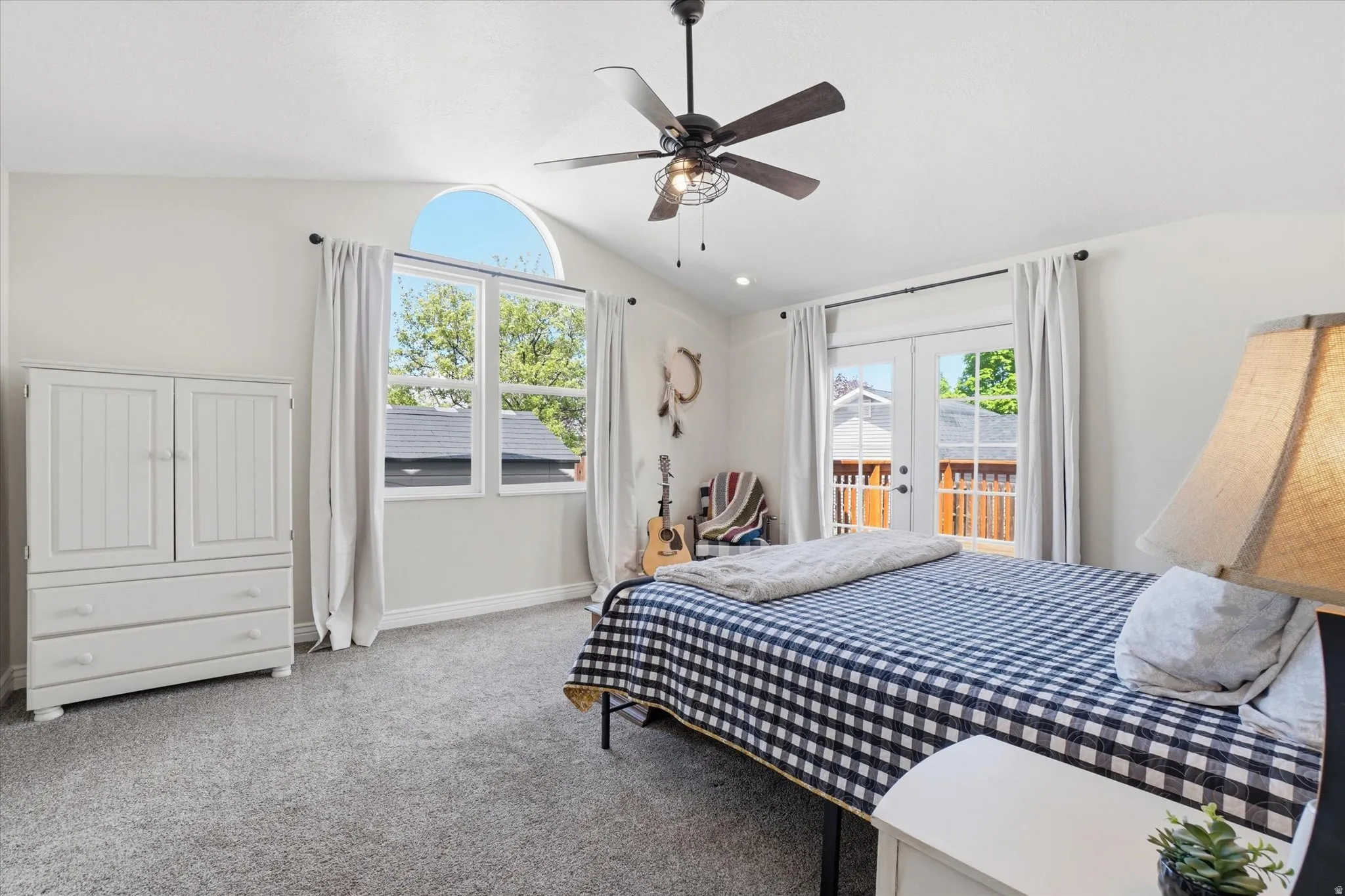 Carpeted bedroom featuring french doors, access to exterior, and ceiling fan