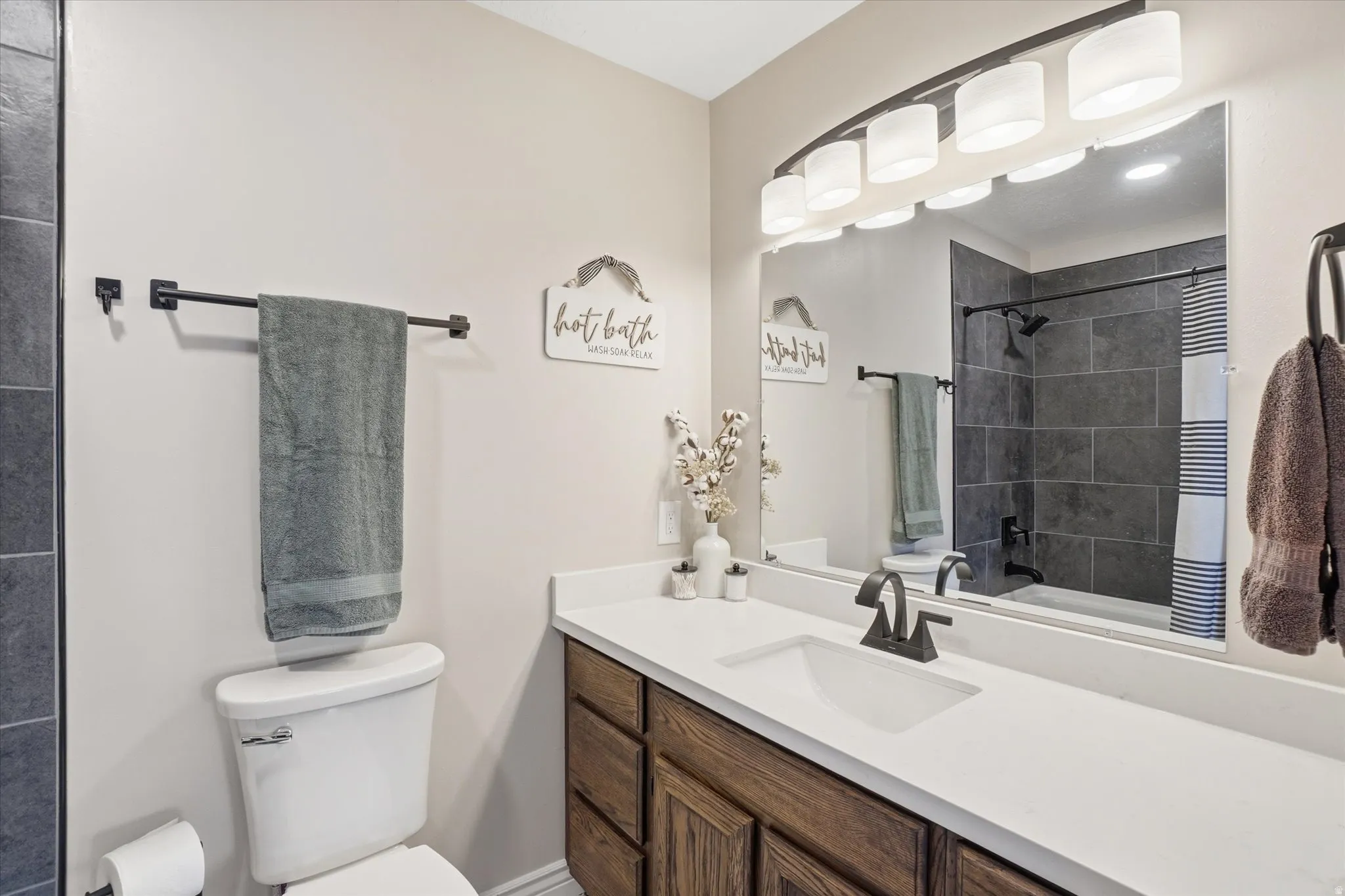 Full bathroom featuring vanity and shower / bath combination