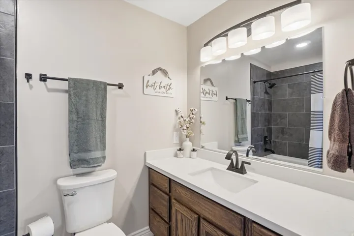 Full bathroom featuring vanity and shower / bath combination