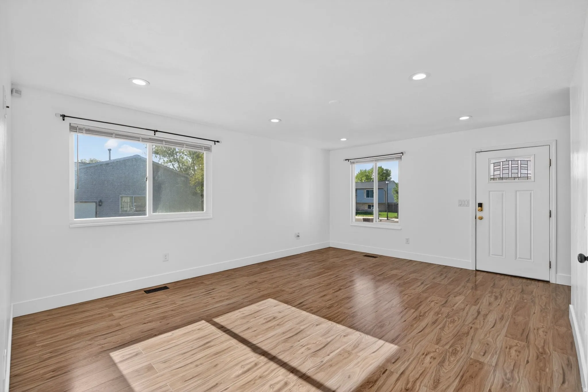 Entrance foyer featuring light wood-style flooring and recessed lighting