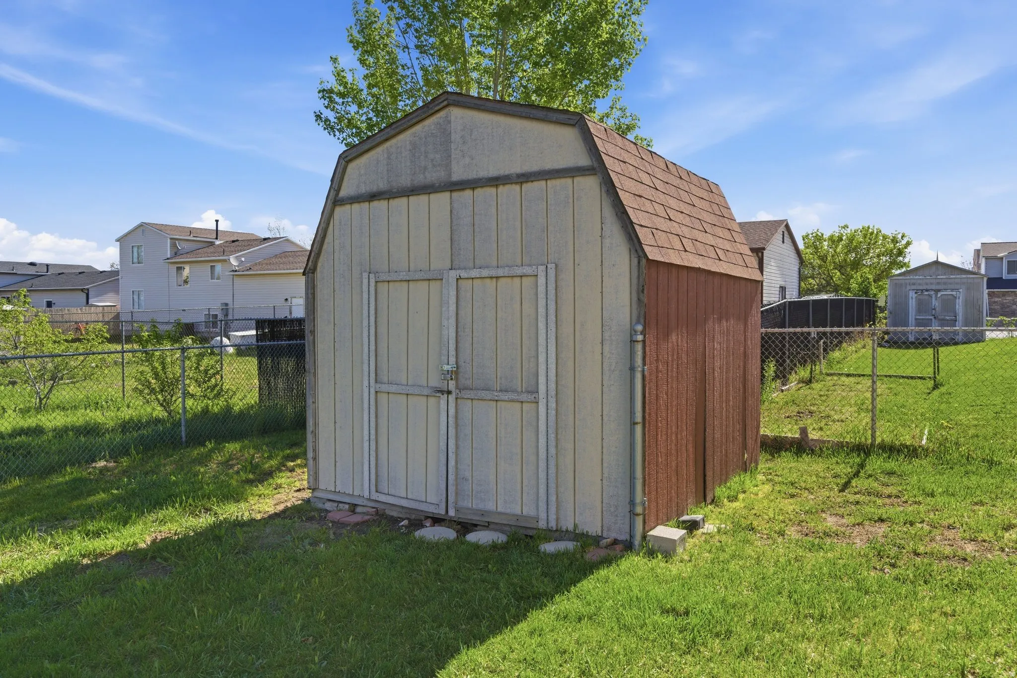 View of shed with a fenced backyard