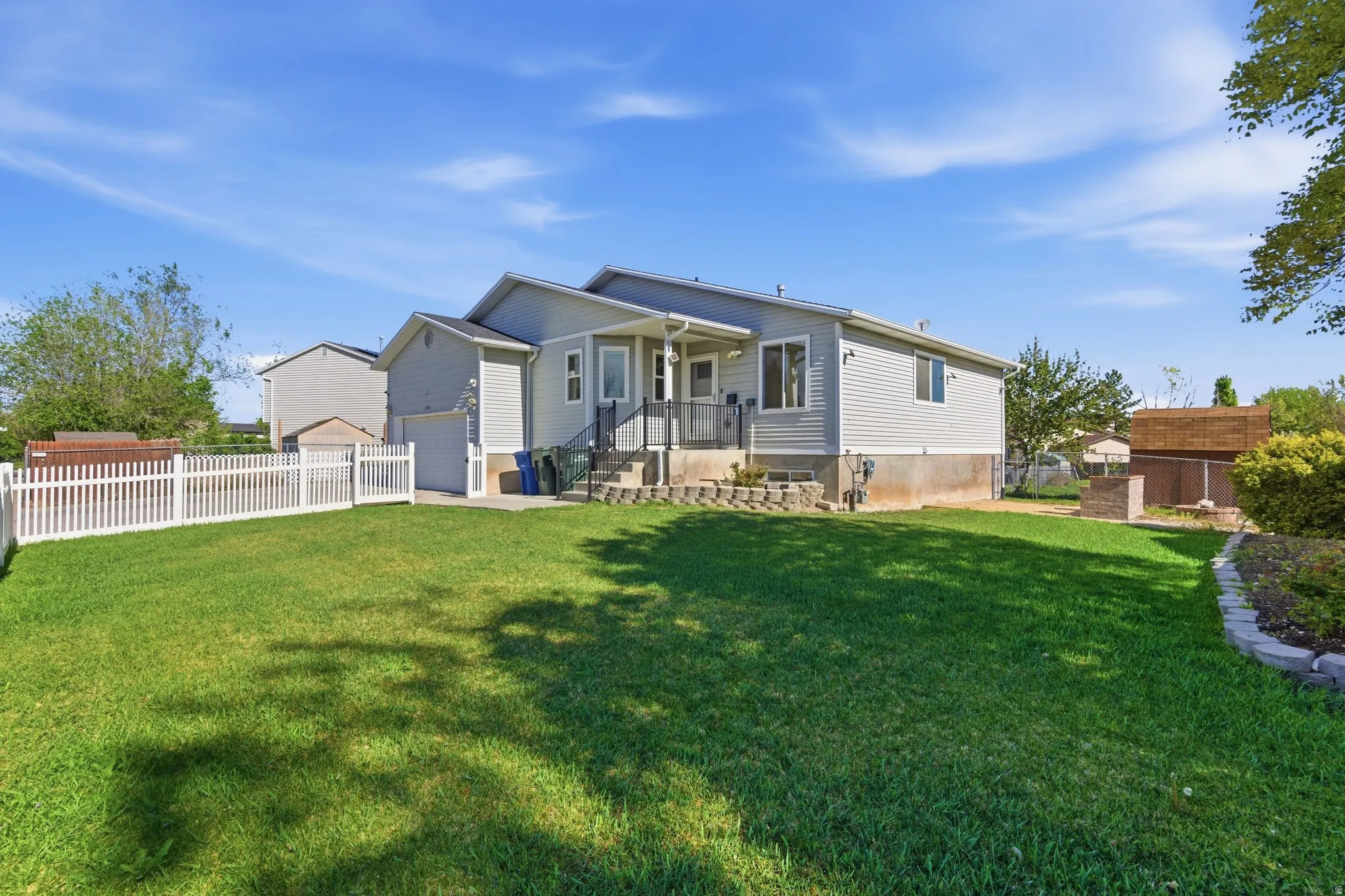 Rear view of property featuring a patio