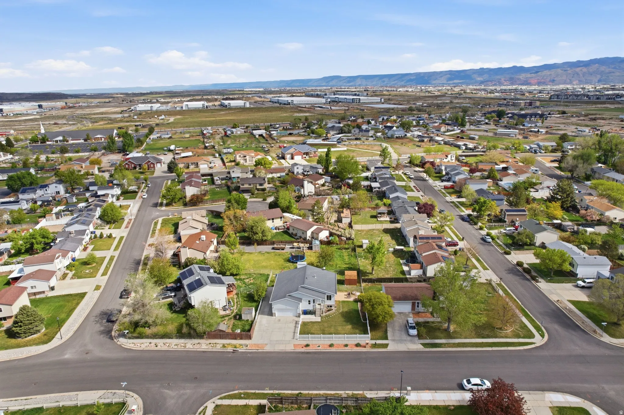 Aerial view of residential area featuring a mountain backdrop