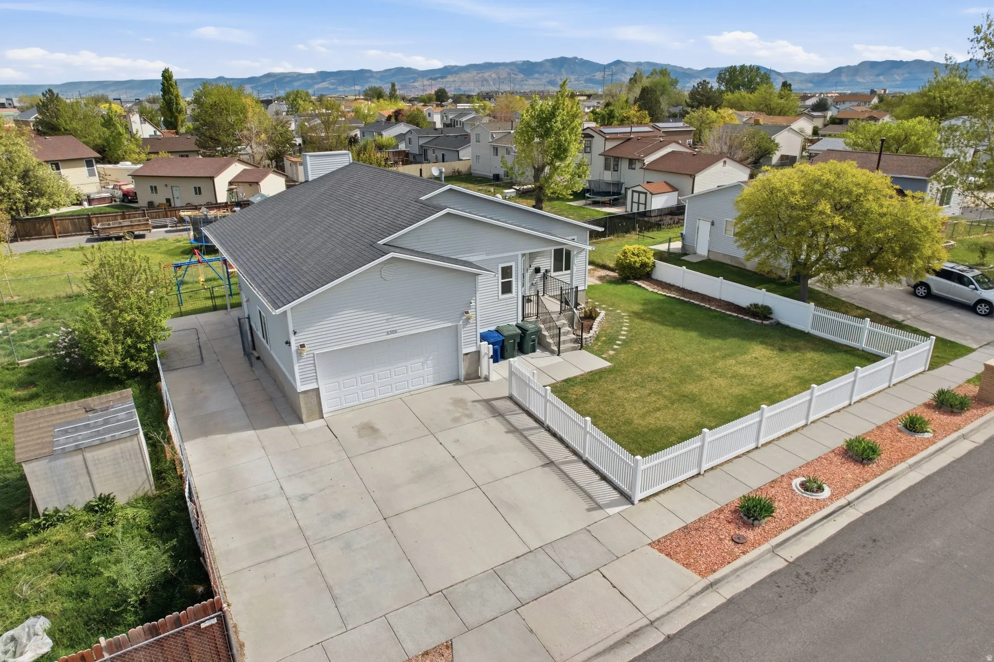 Aerial perspective of suburban area with a mountain backdrop