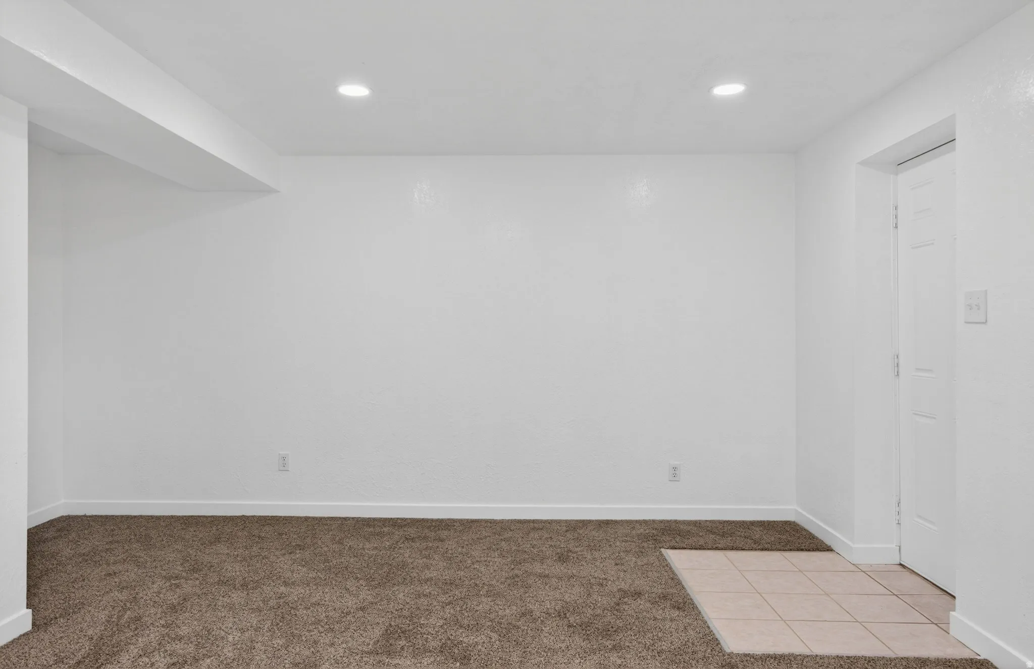 Unfurnished room featuring carpet and recessed lighting