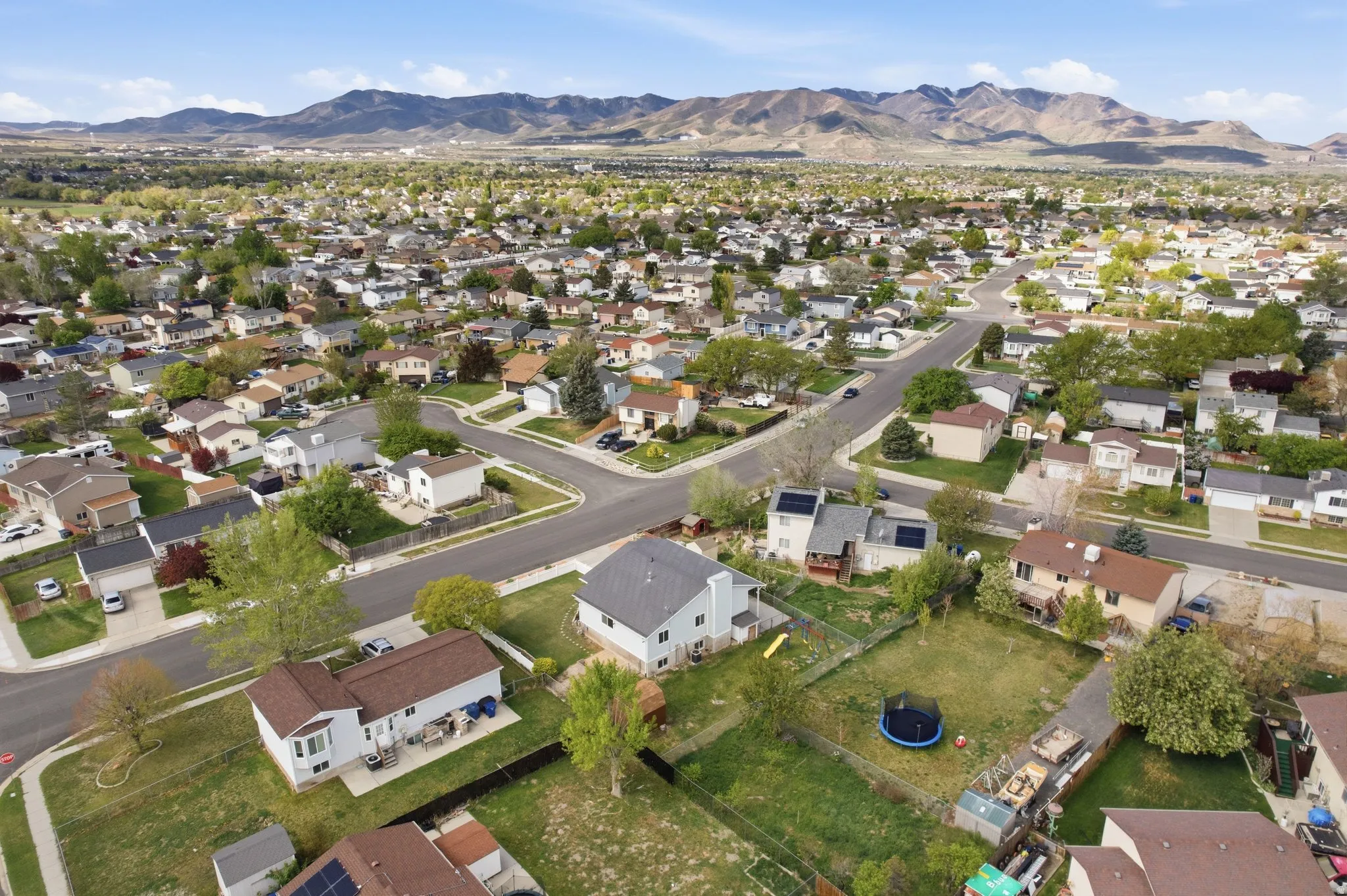 View of property location with a mountainous background and nearby suburban area