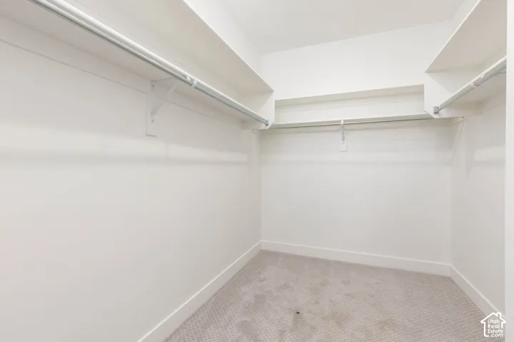 Walk-in closet with integrated shelving and hanging rods