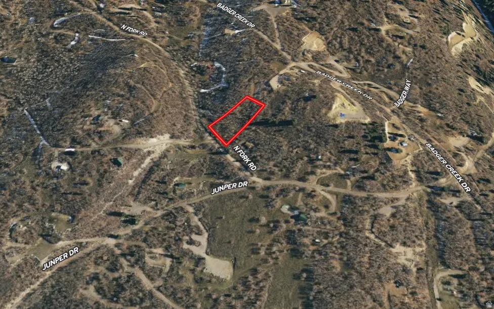Aerial map of property and surrounding area featuring property boundaries highlighted