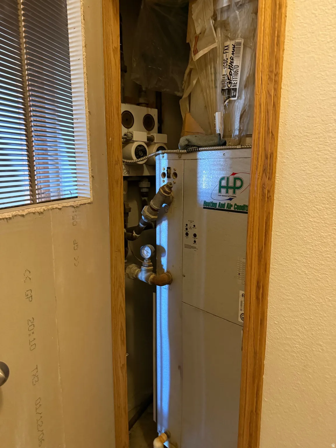 Utility room featuring heating unit