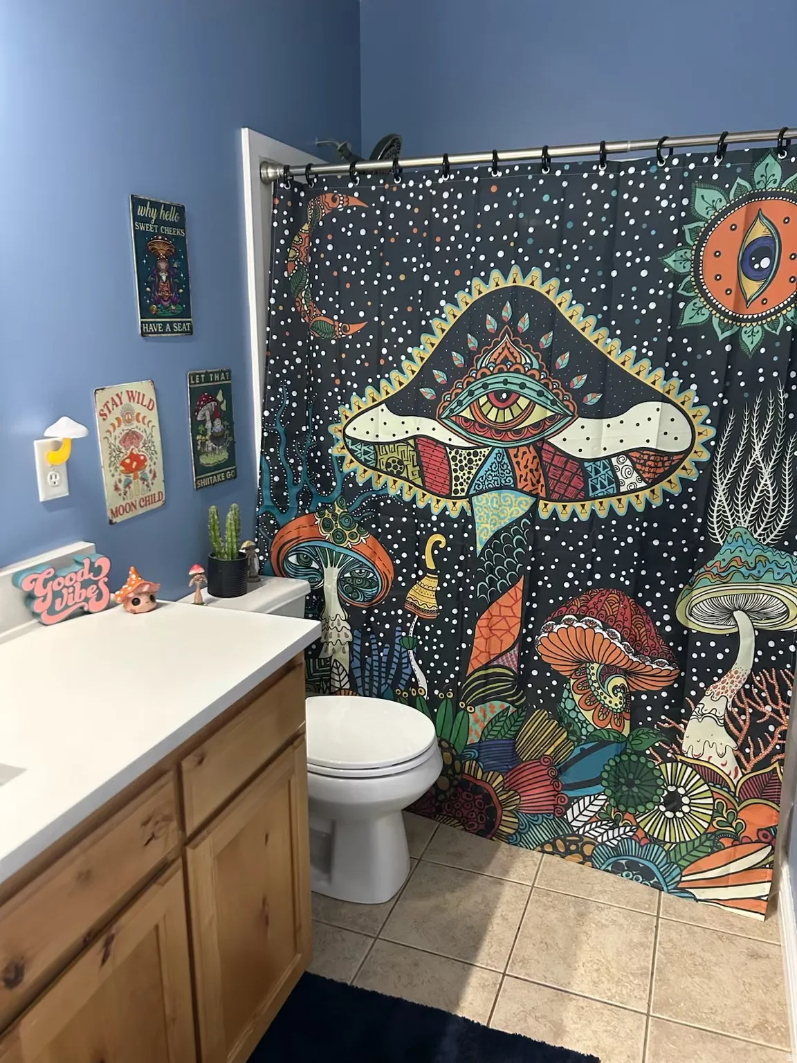Full bathroom with a shower with shower curtain, vanity, and light tile patterned flooring