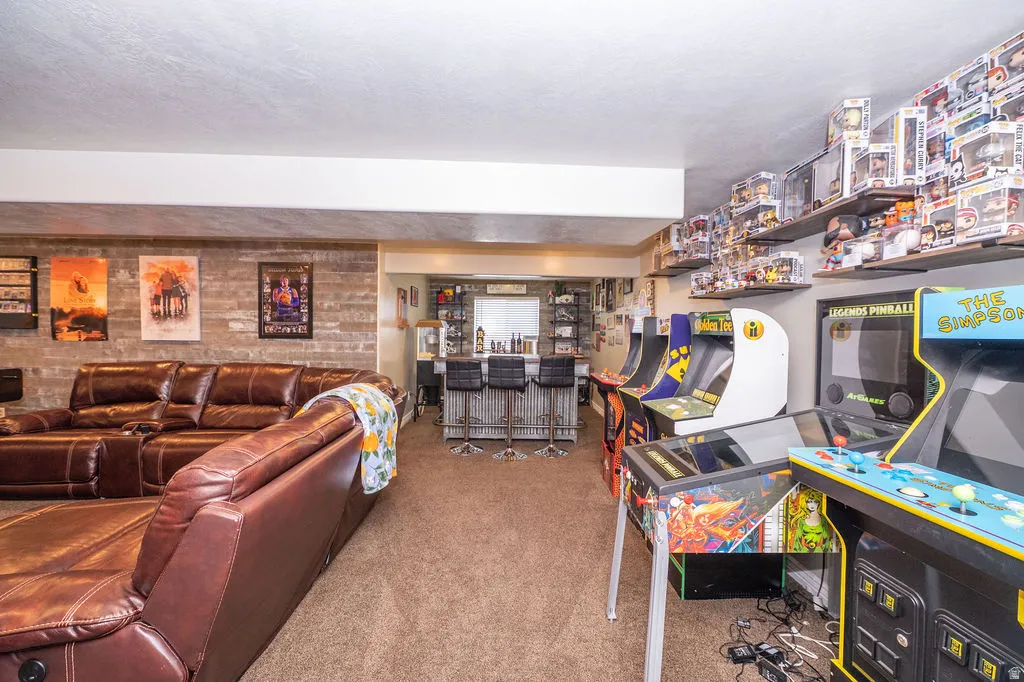 Living room with a bar and carpet floors