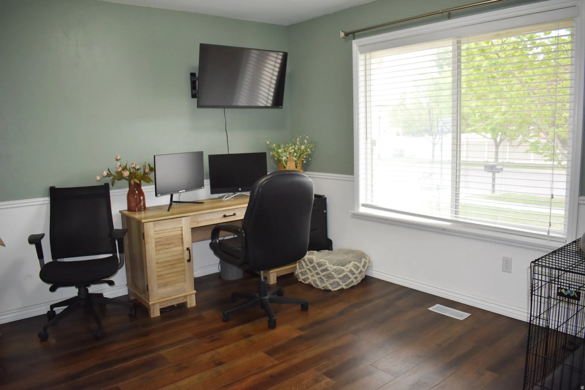 Home office featuring dark wood finished floors
