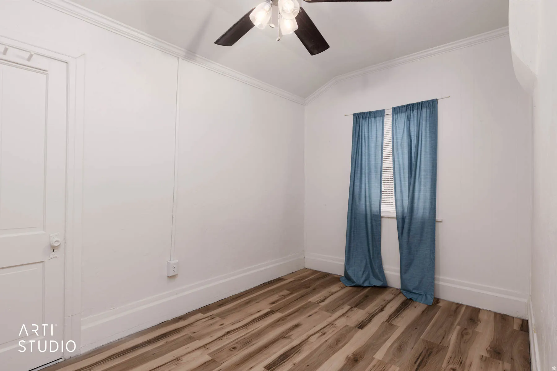 Unfurnished room featuring ornamental molding, light wood-type flooring, a ceiling fan, and lofted ceiling