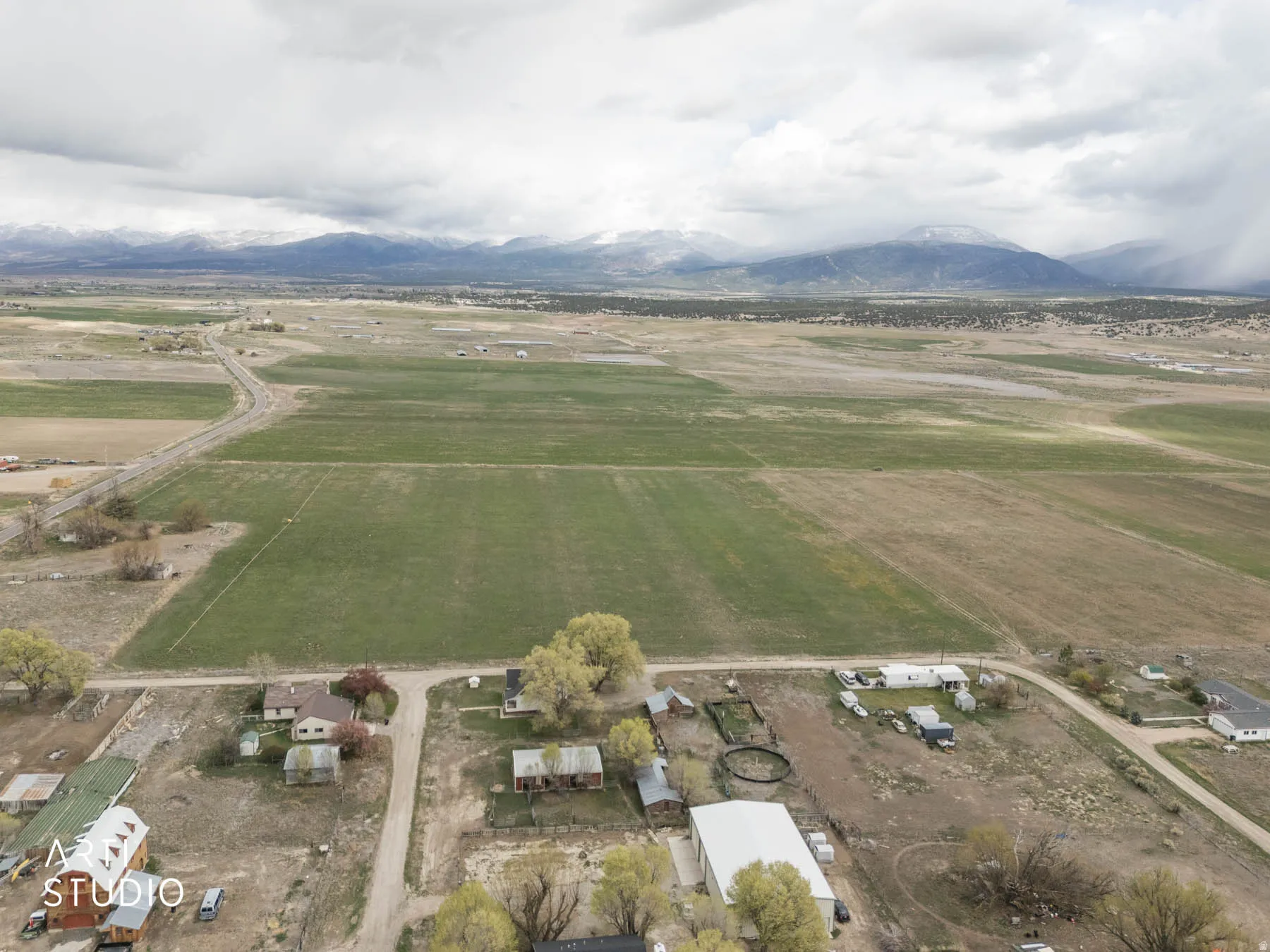 Aerial view of sparsely populated area with a mountainous background