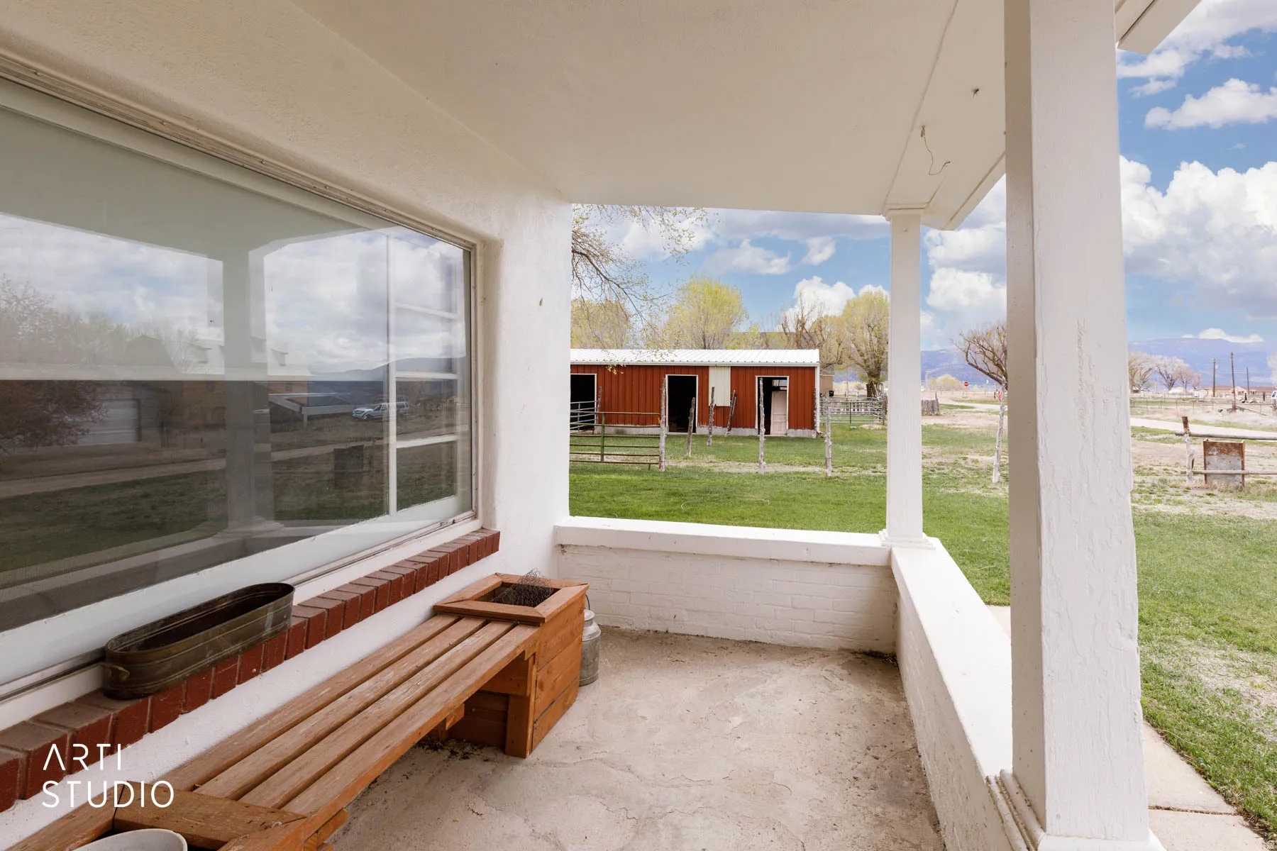Unfurnished sunroom featuring covered porch