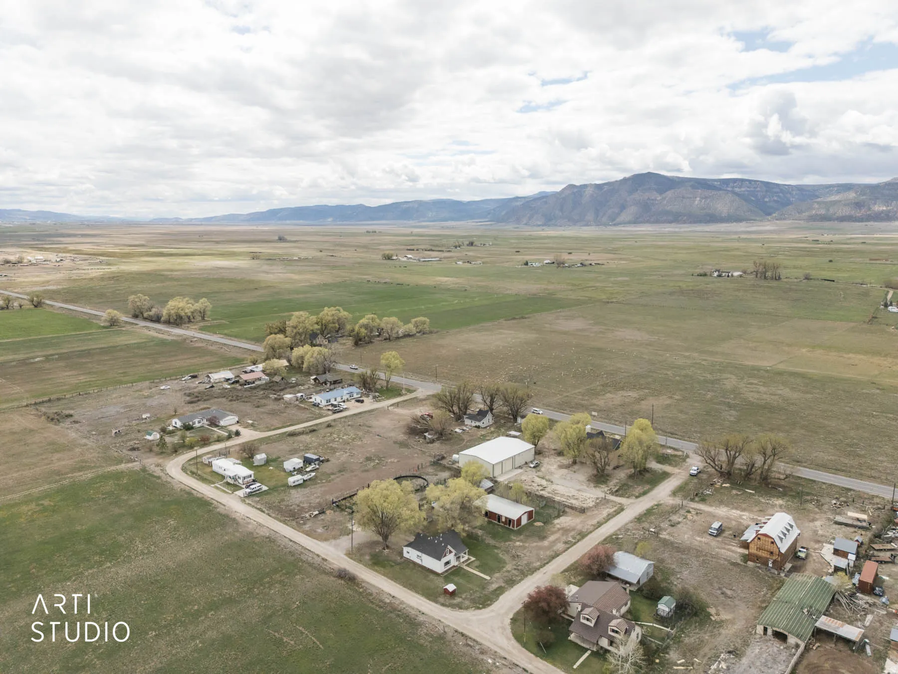 Aerial view of sparsely populated area with a mountainous background
