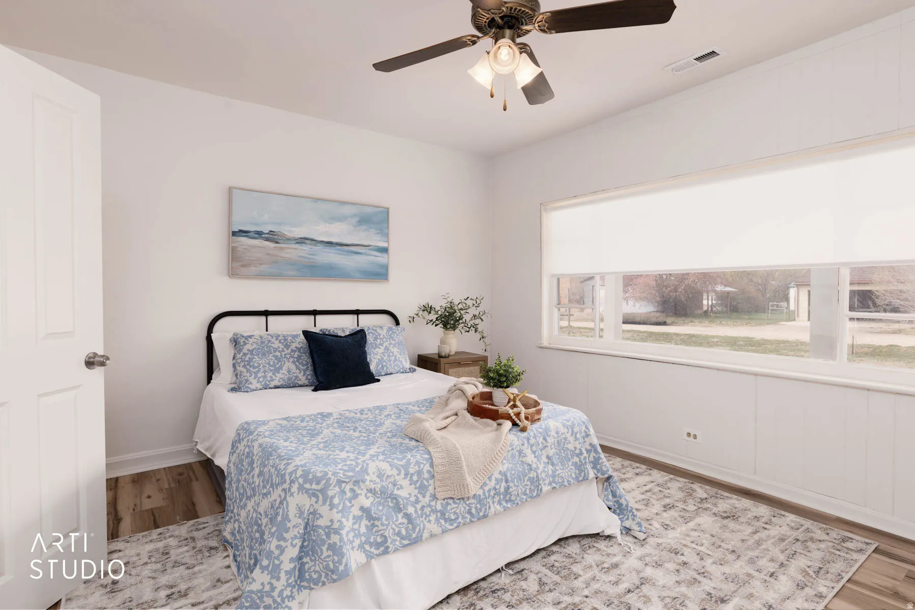 Bedroom featuring wood finished floors and ceiling fan