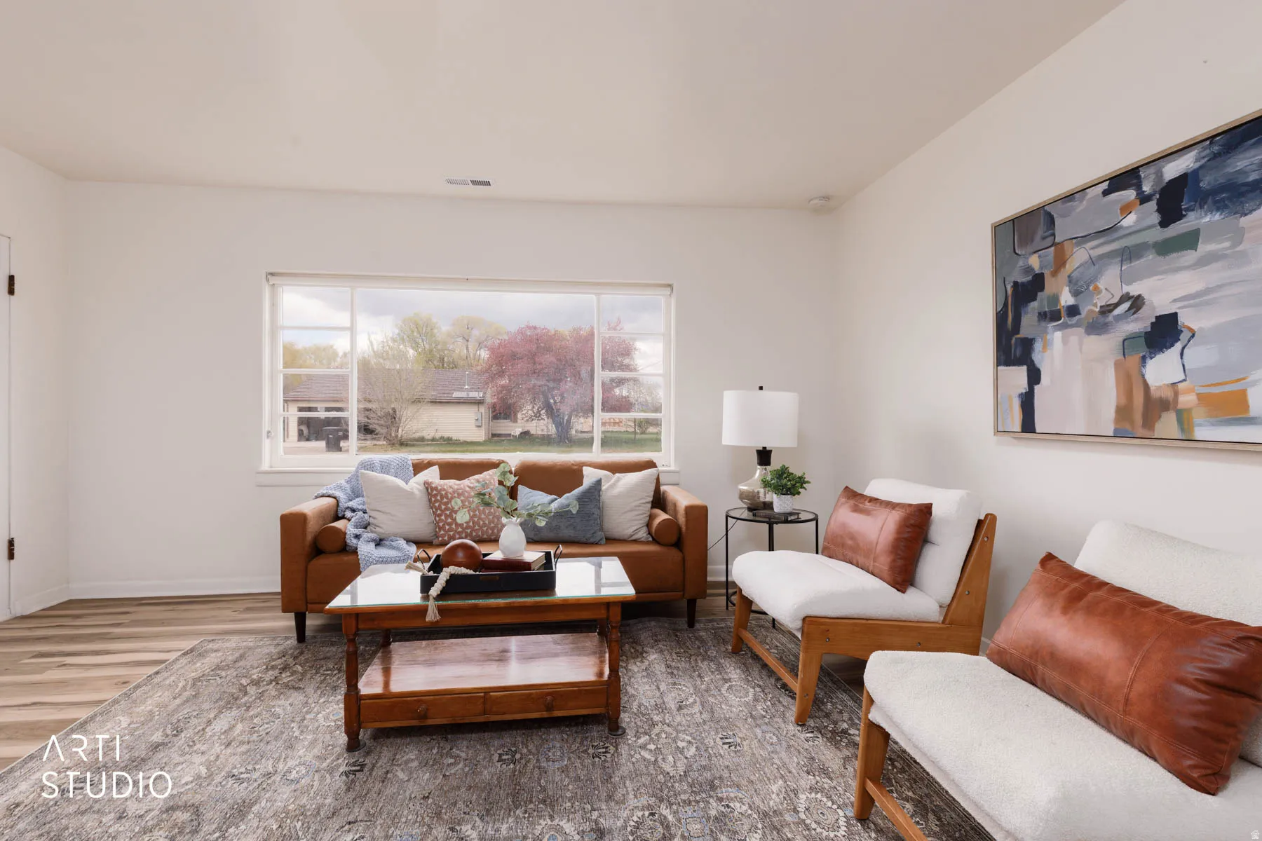 Living area with wood finished floors and baseboards