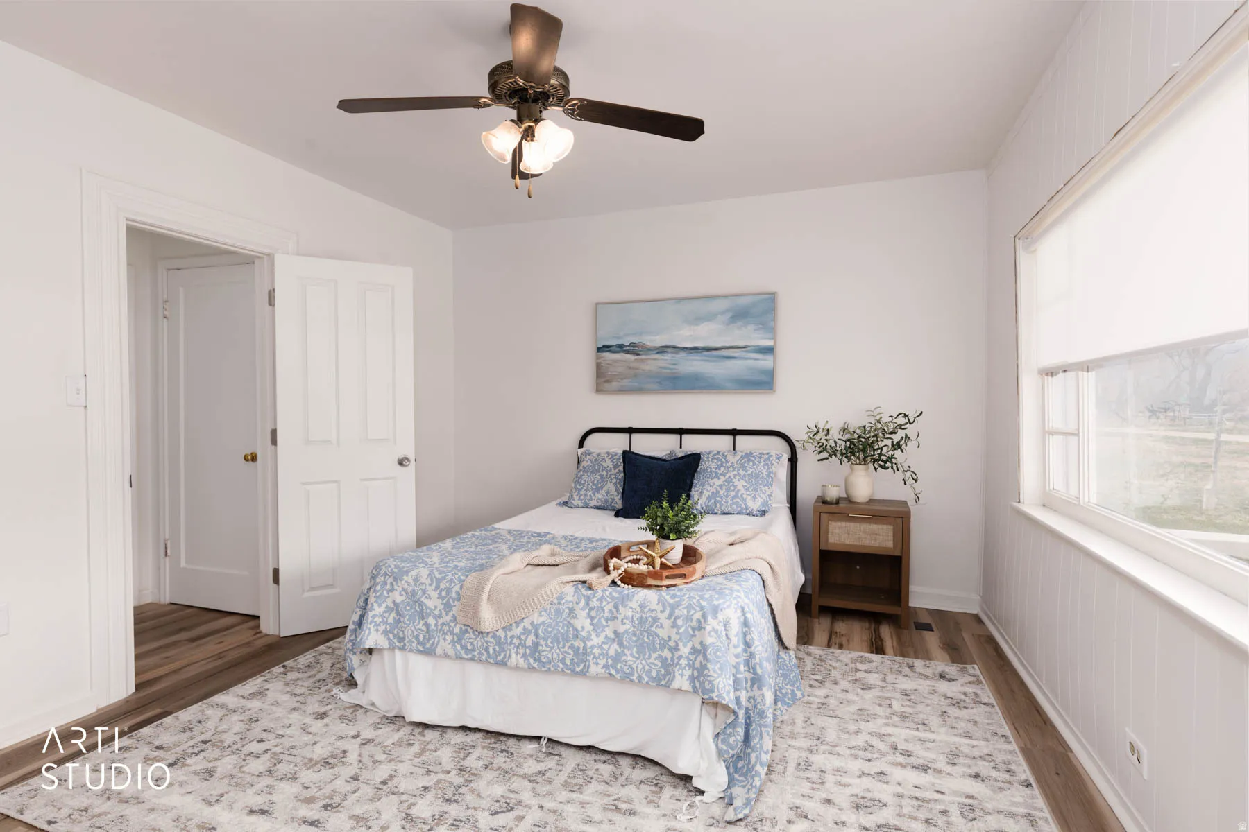 Bedroom with dark wood-style flooring and a ceiling fan