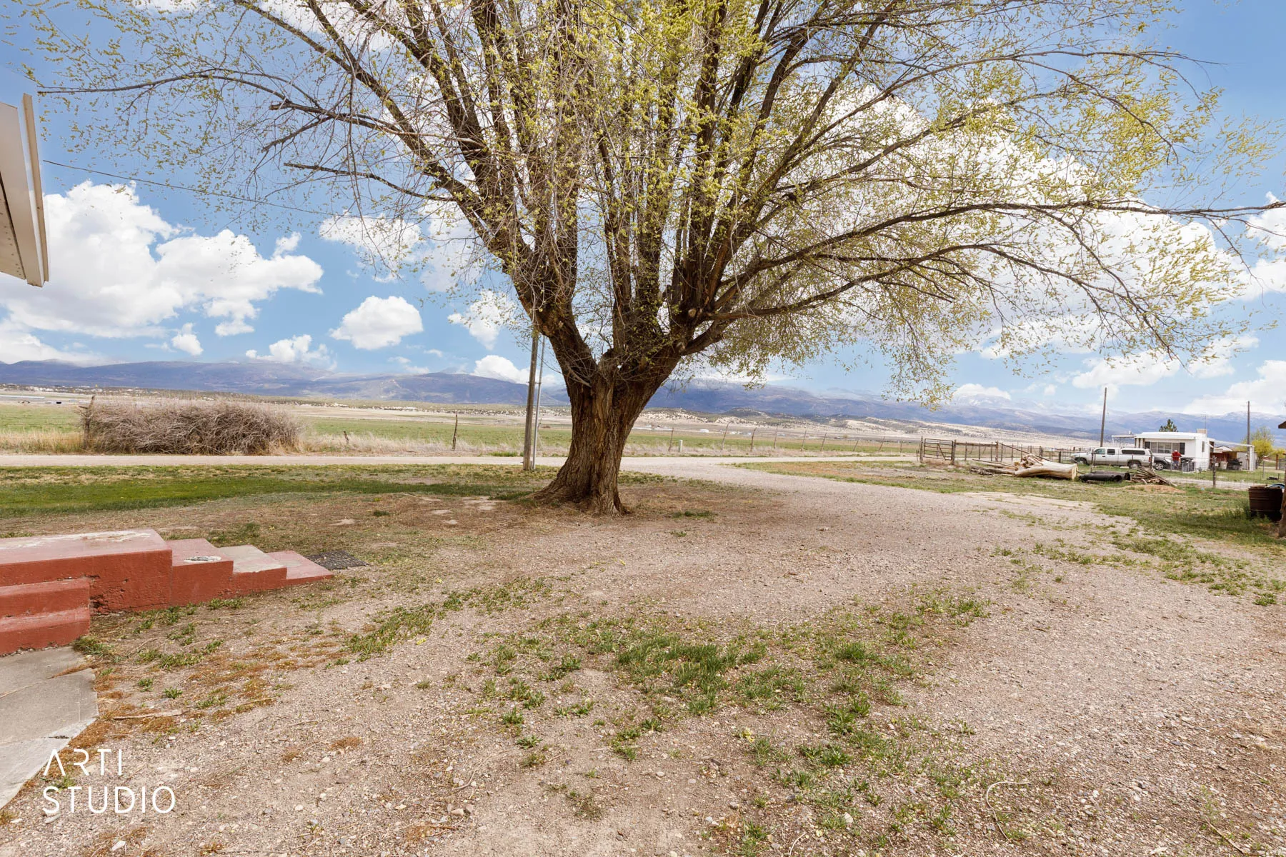 View of yard featuring a view of countryside and a mountain view