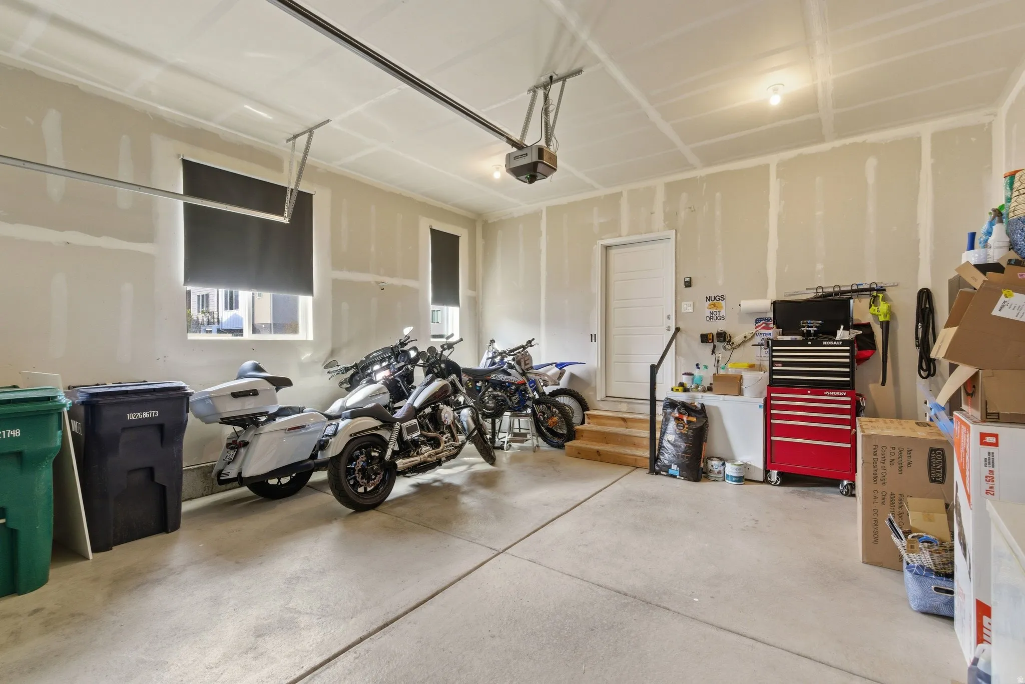 Garage featuring a garage door opener