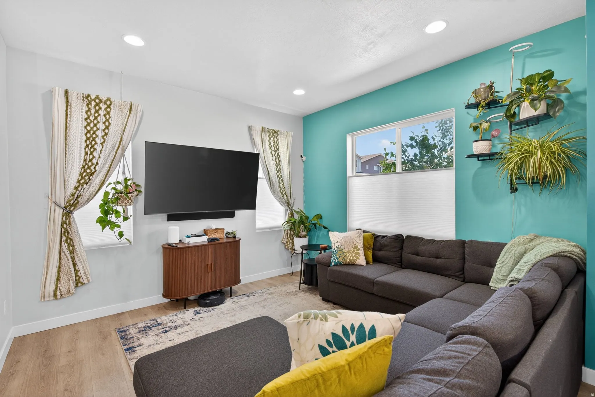 Living room featuring wood finished floors and recessed lighting