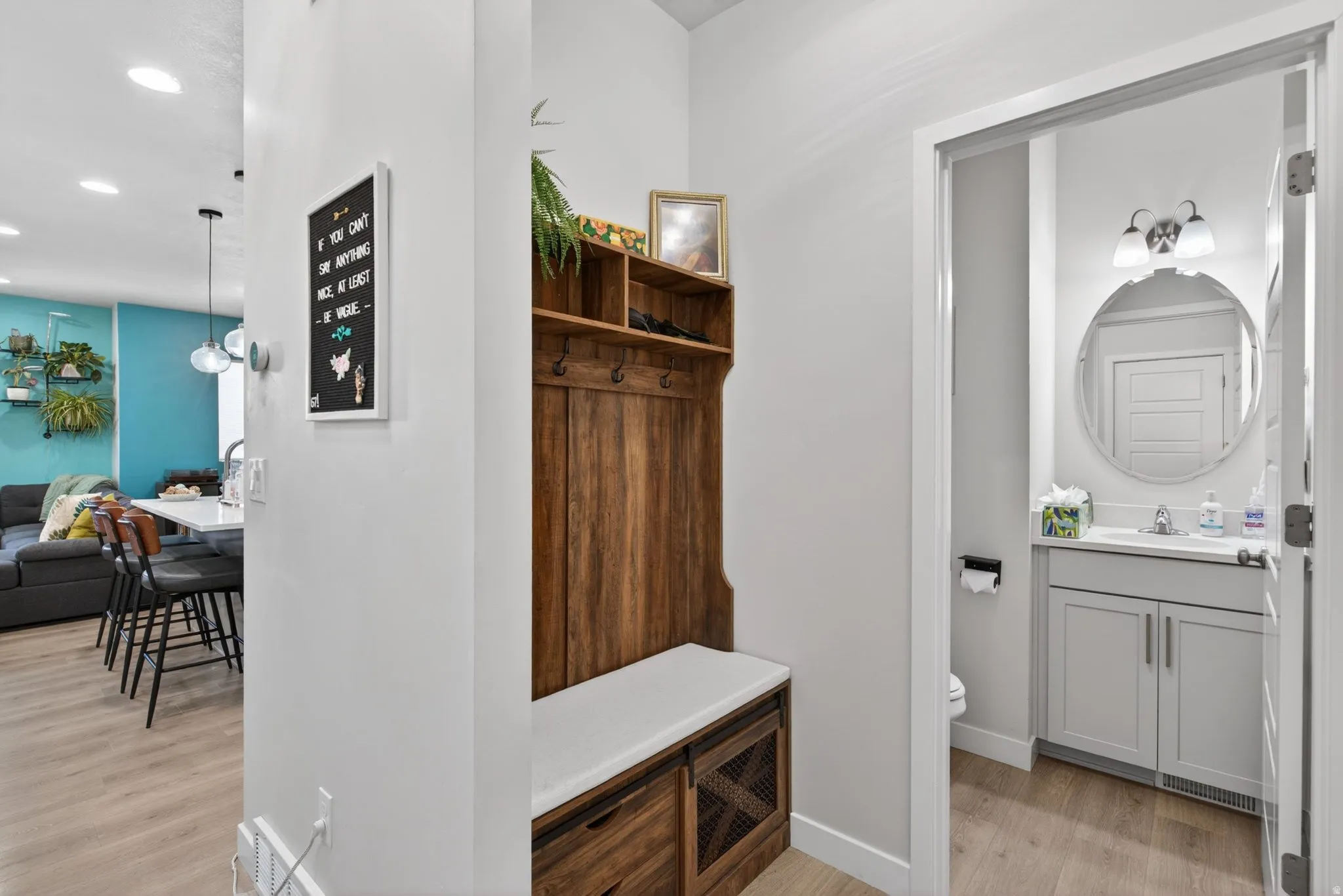 Mudroom featuring light wood-style flooring and recessed lighting