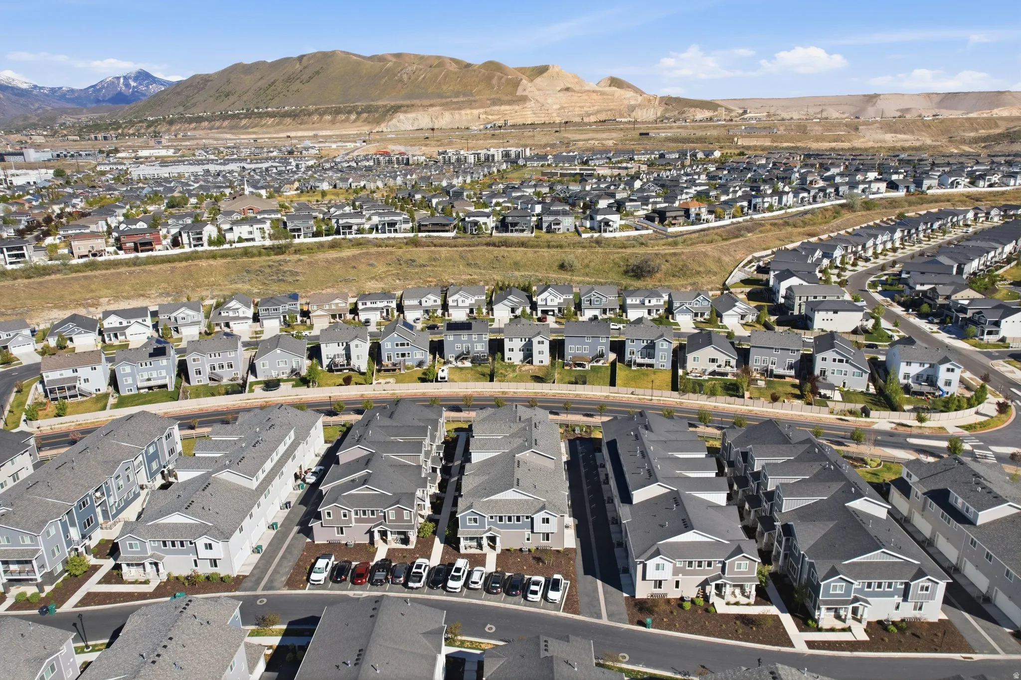 View of property location with nearby suburban area and mountains