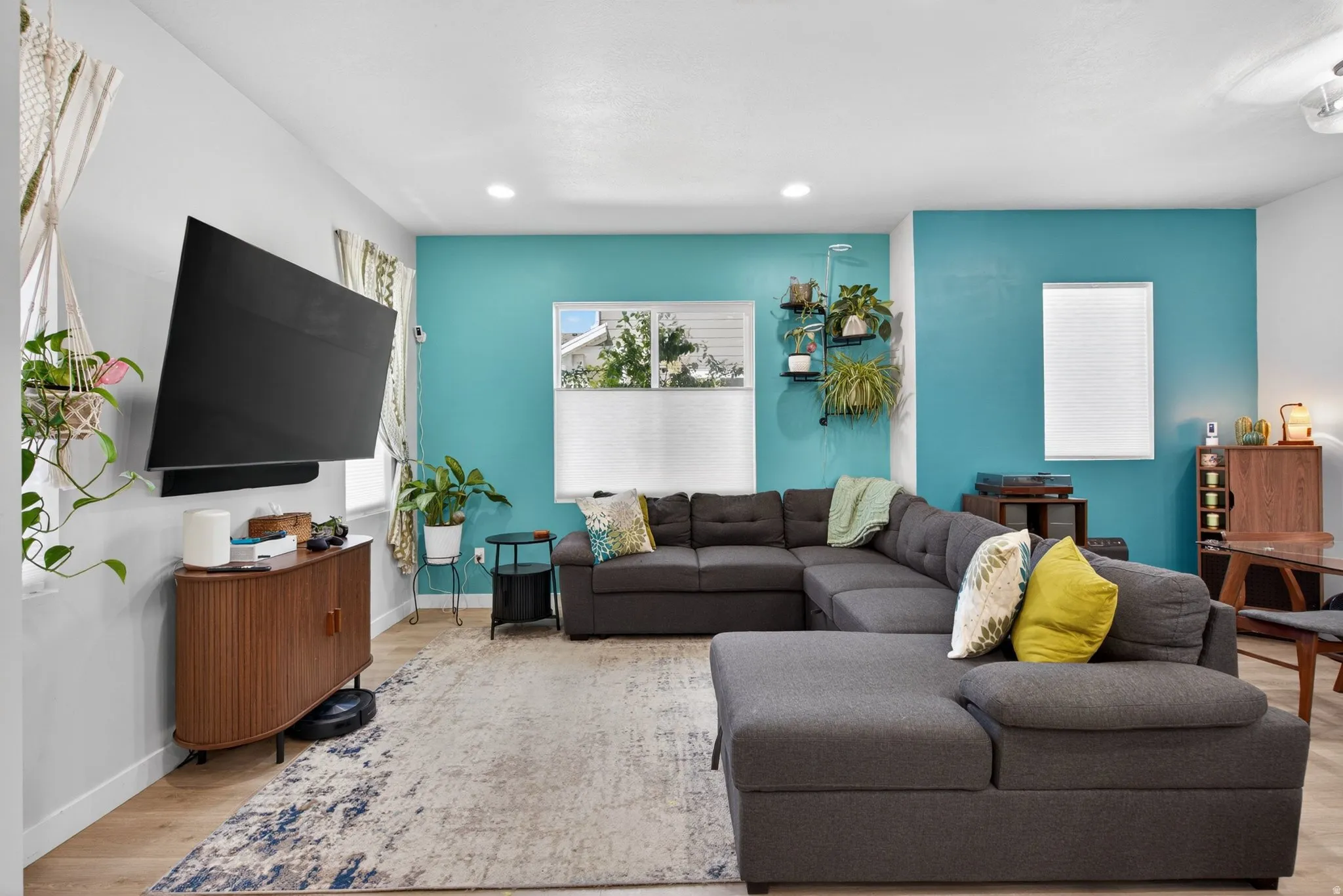 Living area featuring light wood-type flooring and recessed lighting