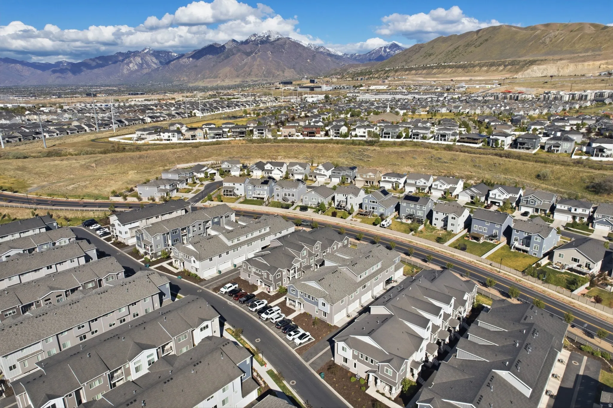 Aerial view of residential area with a mountainous background