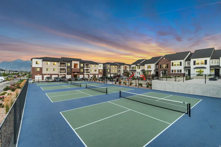 View of tennis court featuring a residential view