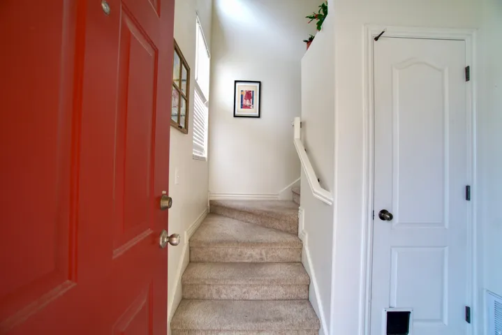 Staircase featuring baseboards