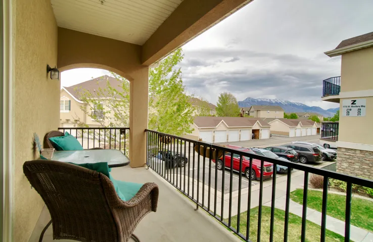 Balcony featuring a mountain view and a residential view