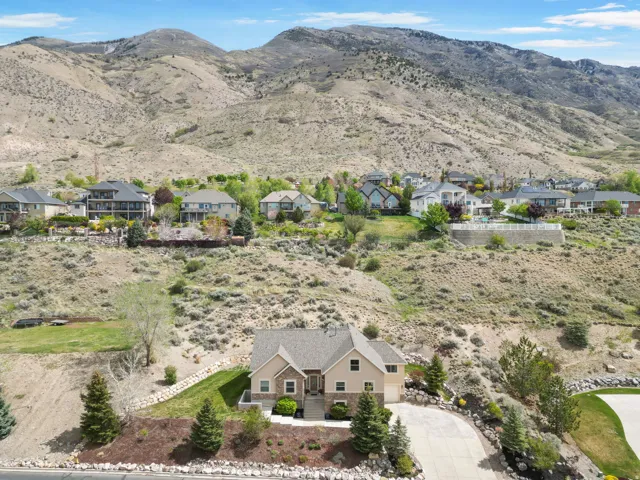 Aerial view of residential area featuring a mountainous background