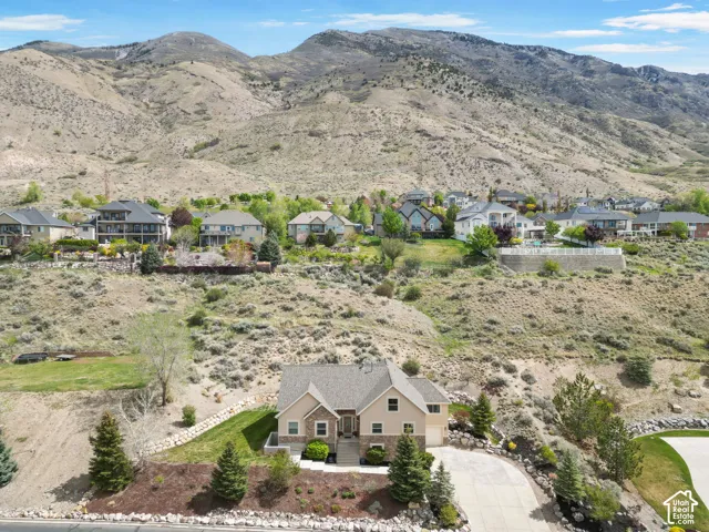Aerial view of residential area featuring a mountainous background