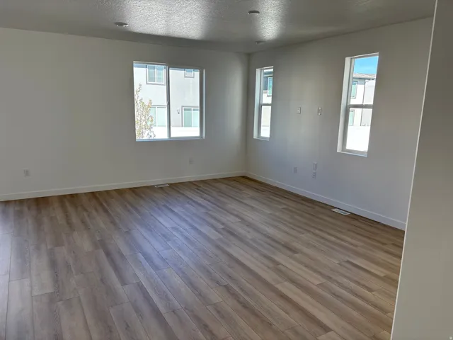 Sun-drenched living room with a clean, modern feel and room to relax.