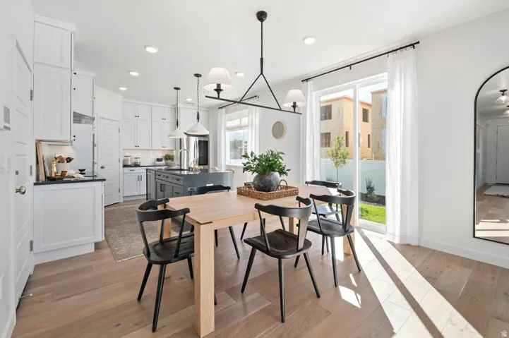 A clear, open dining zone ready for hosting or homework. *Model Home Photo