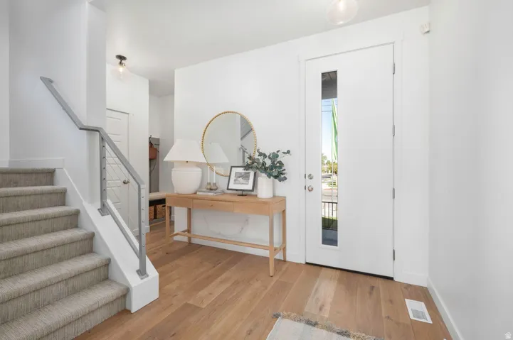 The kind of entry that makes guests feel instantly welcome. *Model Home Photo