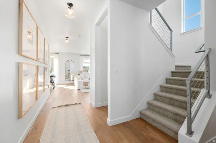 A welcoming foyer that feels both open and cozy from the moment you arrive. *Model Home Photo