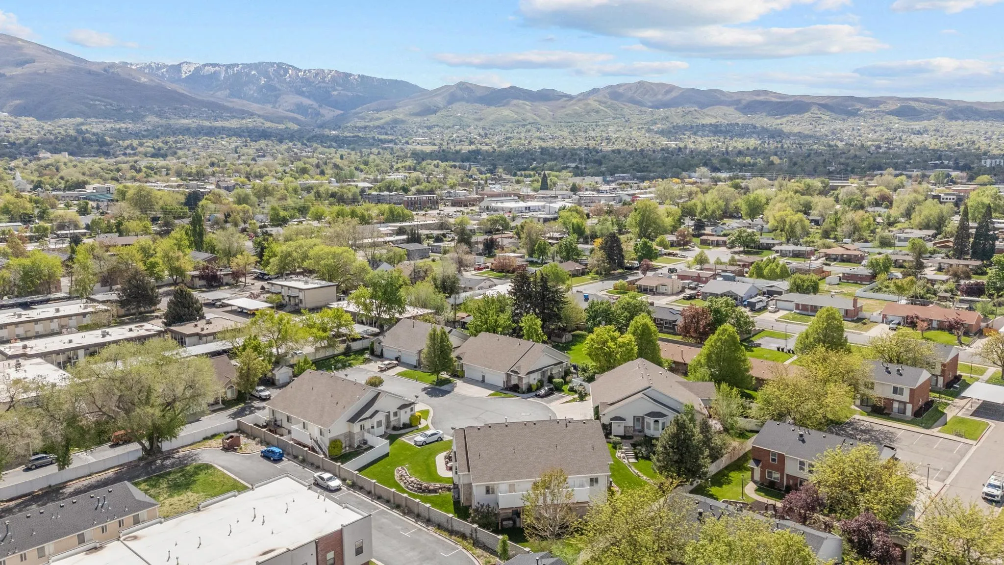 Aerial view of residential area featuring mountains