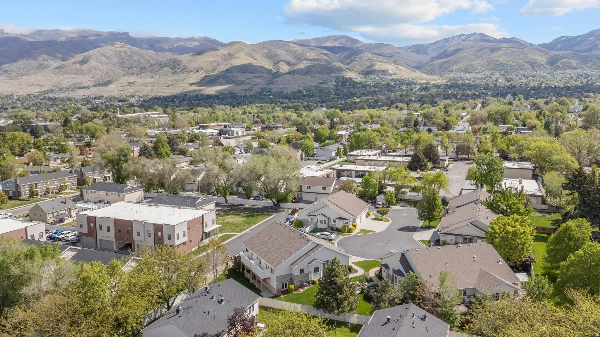 Aerial view of residential area with a mountain backdrop